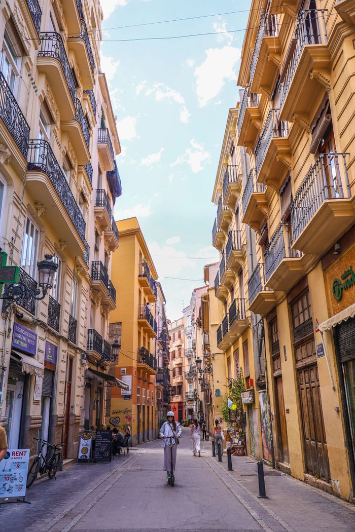services-01 Picturesque street view in Valencia featuring historical architecture and vibrant atmosphere.